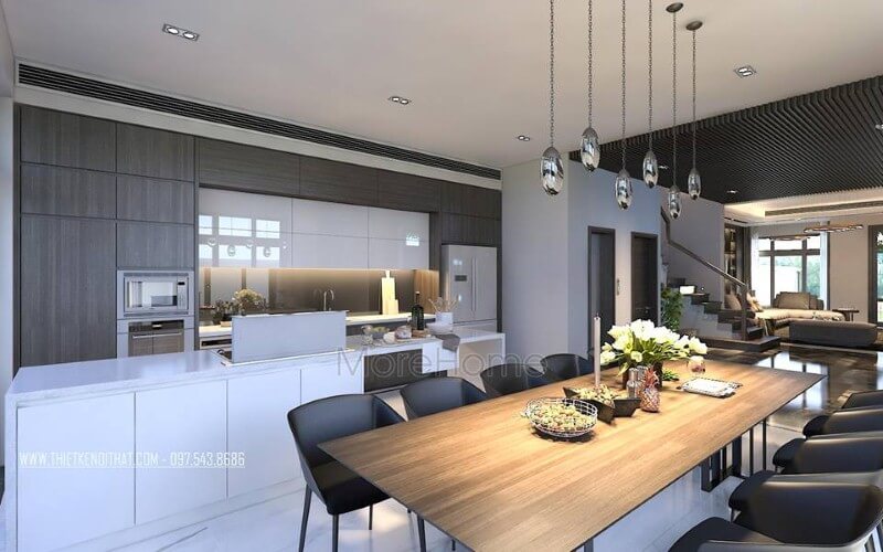 Bố trí nội thất phòng ăn liền bếp hiện đại, sang trọng từ tủ bếp đảo kết hợp đá ốp cao cấp cùng bộ bàn ghế ăn gỗ nguyên tấm độc đáo. Mẫu nội thất biệt thự đẹp