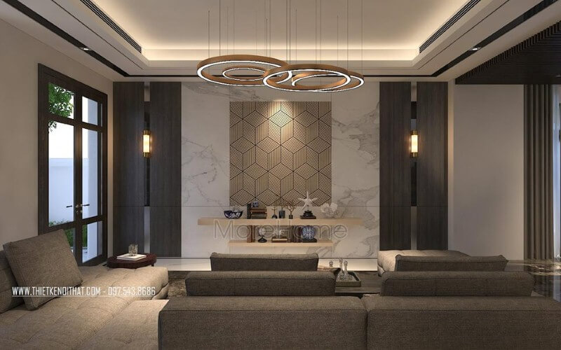 Bố trí phòng khách hiện đại ấn tượng với đá ốp tường cao cấp cùng họa tiết 3D độc đáo. Thiết kế phòng khách nhà phố