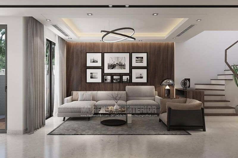Trang trí tường phòng khách đẹp độc đáo với gỗ ốp tường kết hợp tranh đen trắng canvas.