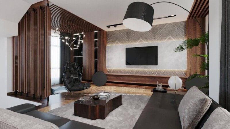 Là một trong những không gian nội thất phòng khách biệt thự đẹp được thiết kế theo lối hiện đại nhưng lại sử dụng chất liệu gỗ làm chủ đạo đã tạo nên vẻ đẹp độc đáo, mới lạ trong Vinhomes Imperia Hải Phòng. Gỗ được biến hóa độc đáo nhưng lại mang tính liền mạch, từ chất liệu làm kệ trang trí, gỗ ốp tường, tạo điểm nhấn đến kệ trang trí. Tuy nhiên không làm cho không gian bị trầm, bởi sự kết hợp khéo léo khi sử dụng chất liệu đá ốp tường có độ bóng sang cùng gam màu tương phản, kết hợp cùng màu đơn sắc trần thạch cao đã làm không gian như trở thành bức tranh hài hòa nhưng lại cuốn hút không ngờ.
